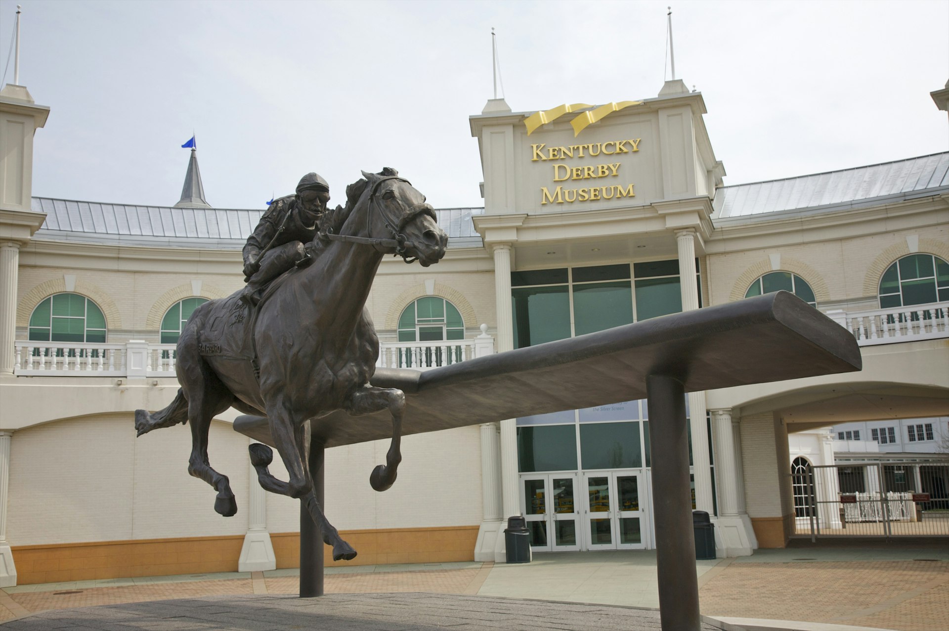 A sculpture of a jockey and horse outside the Churchill Downs track in Louisville