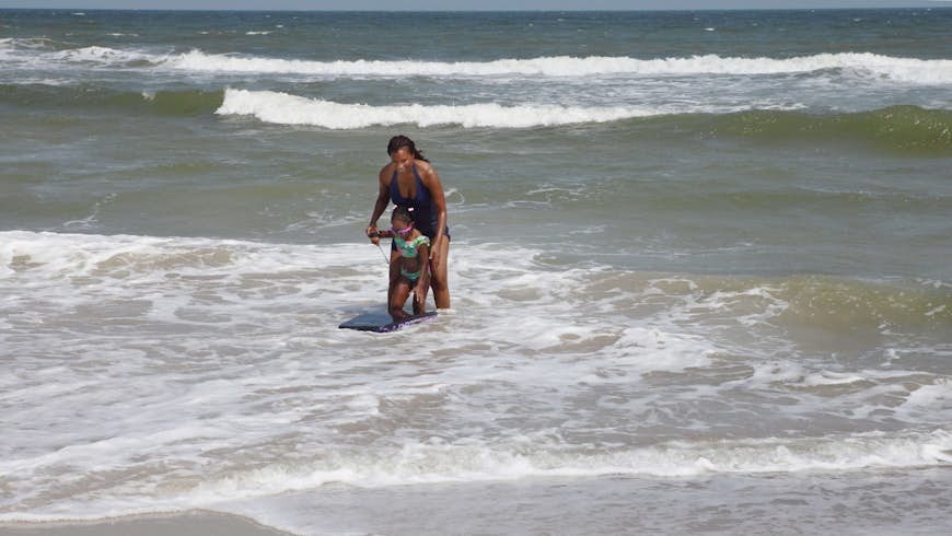 Mom and daughter in the water at Ocean Isle Beach, North Carolina