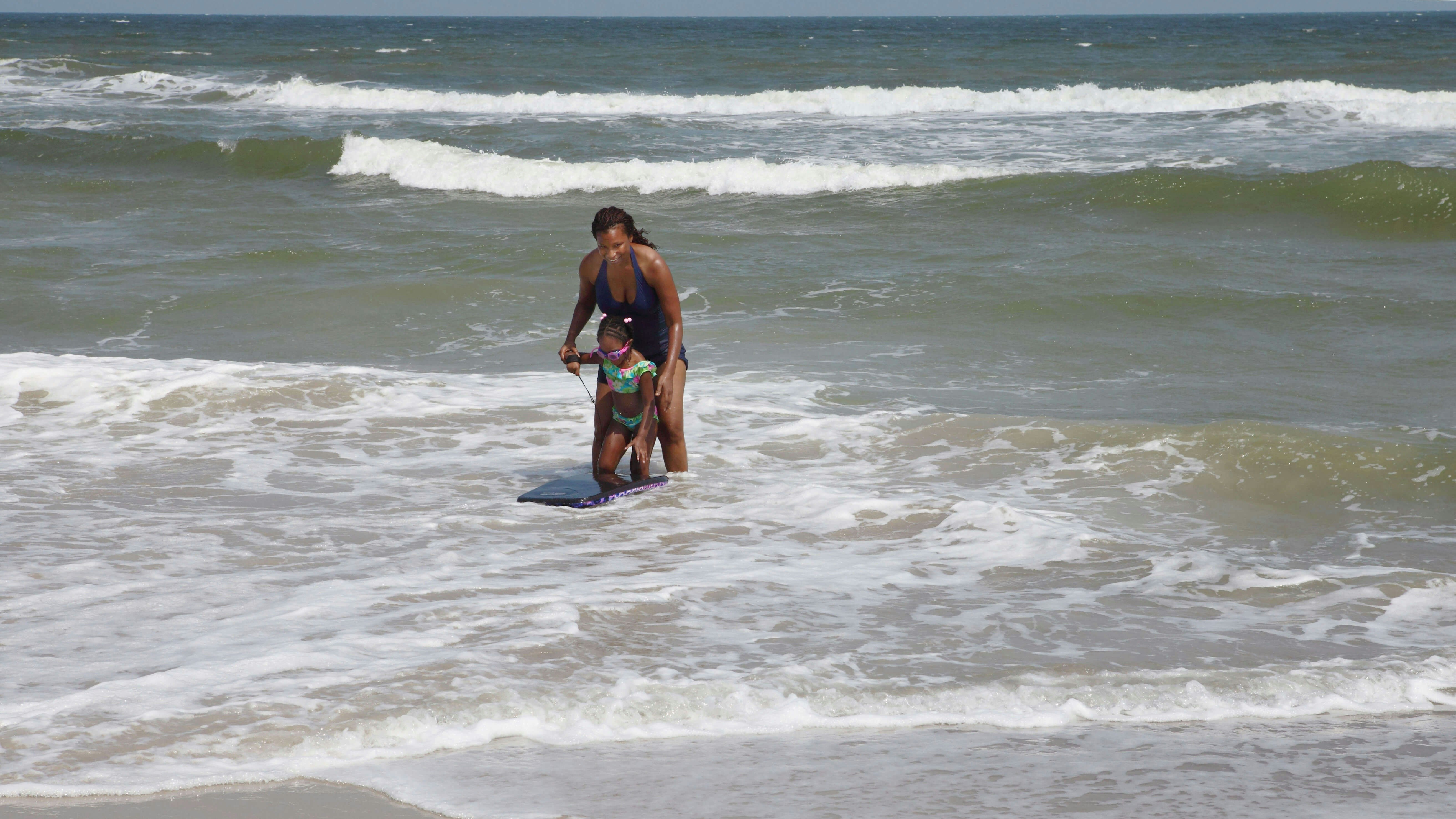 Mom and daughter in the water at Ocean Isle Beach, North Carolina