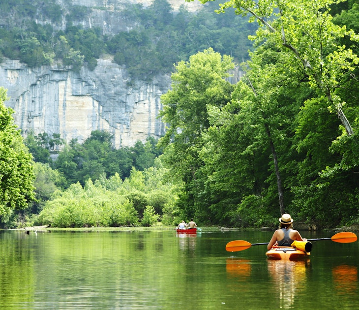 Kayaker and canoeist on the Buffalo National River in Arkansas from Steel Creek Campground.