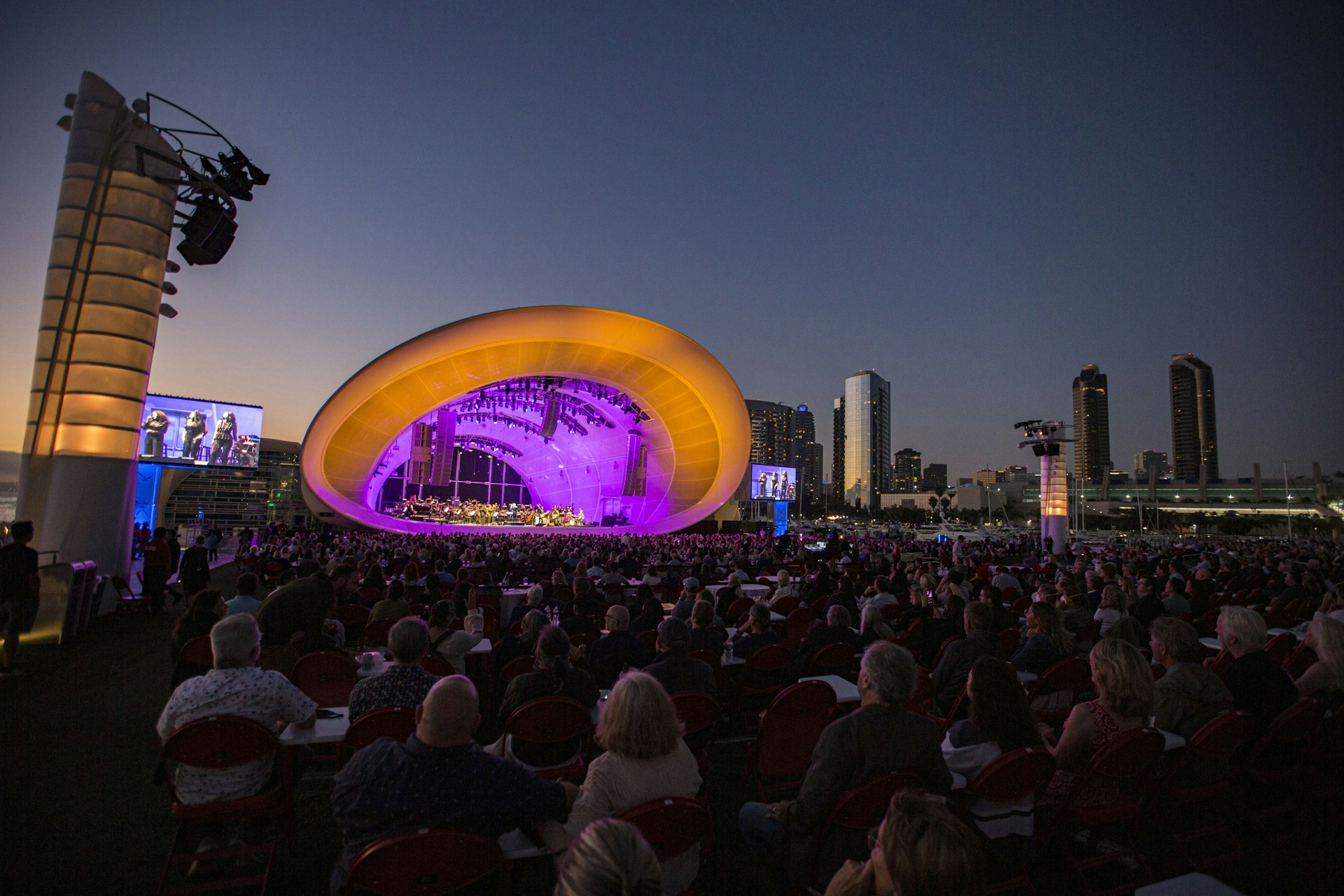 The Rady Shell outdoor music venue lit up at night in San Diego