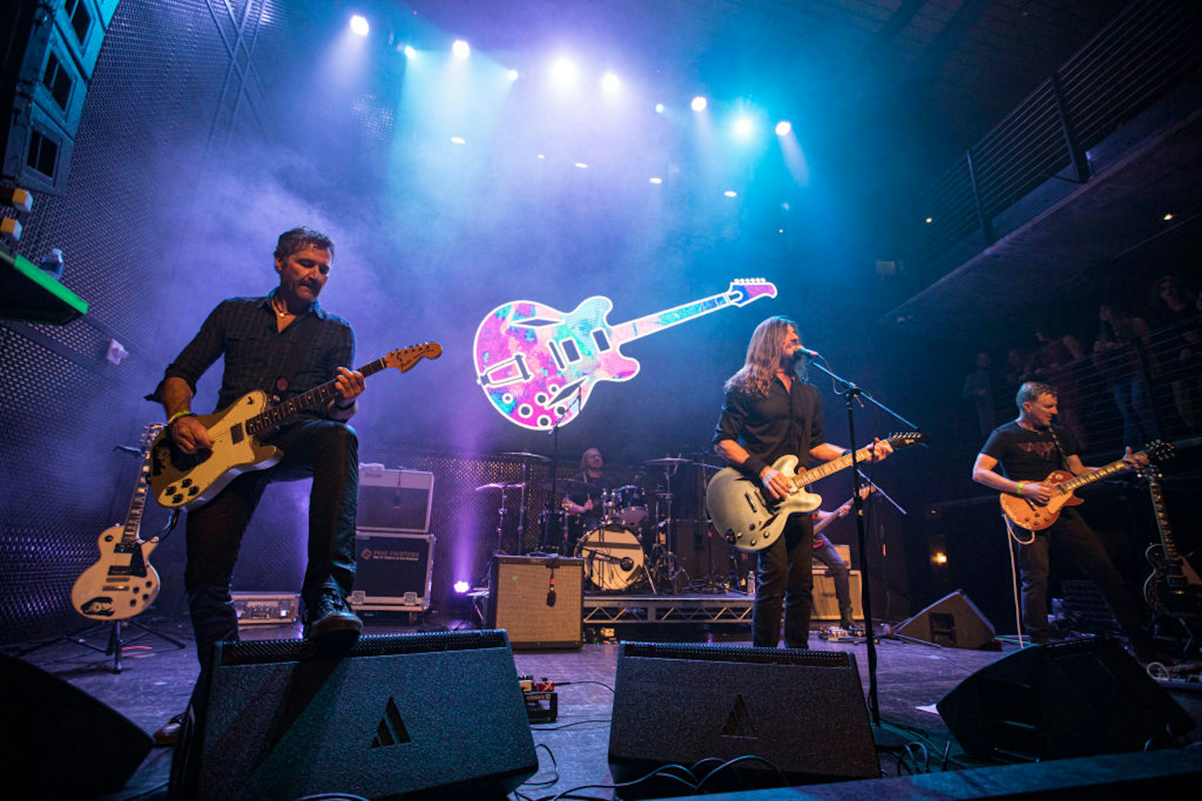 A band performing live on stage at the Music Box in San Diego, USA