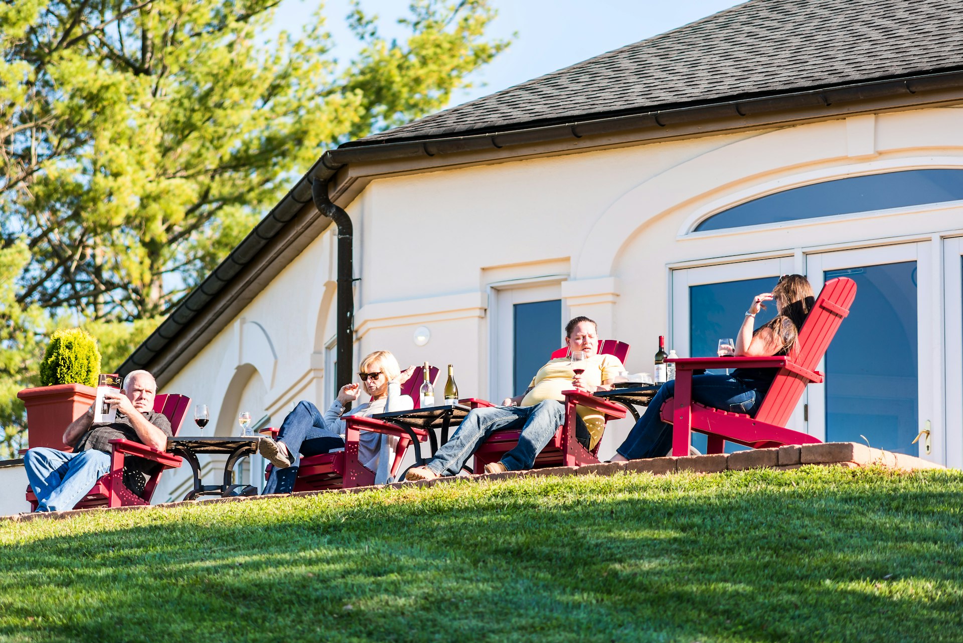 People relaxing by view, eating food and drinking wine at a winery in Barboursville, Virginia, Mid-Atlantic, USA