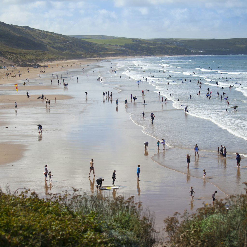 People enjoying the surfing beach of Woolacombe