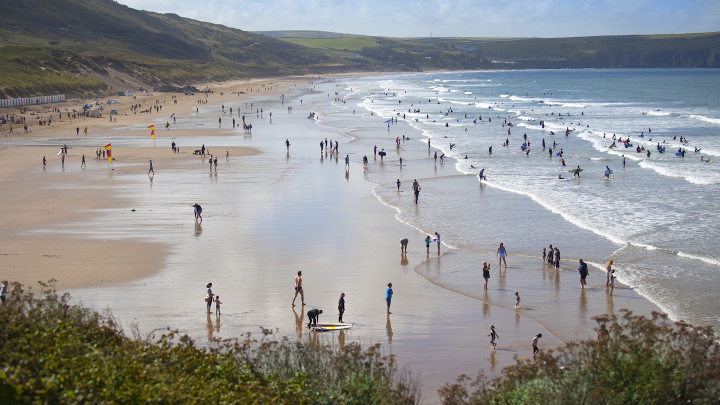 People enjoying the surfing beach of Woolacombe