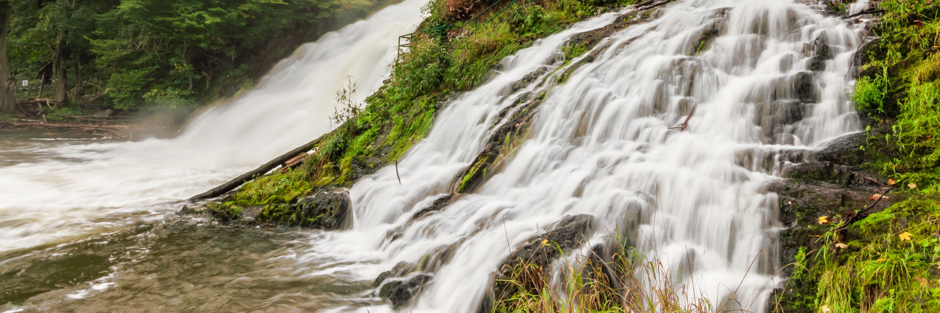 Long exposure of stunning and popular waterfalls in the Belgian Ardennes, Waterfalls of Coo, province of Liege, Wallonia, Belgium. Beautiful nature and sunny day.