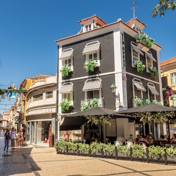 Setúbal, Portugal - August 28, 2020: In downtown Setúbal we find a large part of traditional commerce, where world brands join other older ones, as well as bars and restaurants as in the case of the building depicted in which a restaurant bar operates.