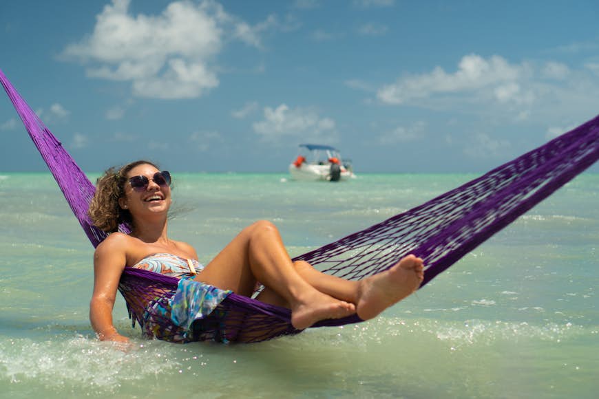 Woman relaxing at Maragogi beach, Brazil