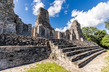 Ancient Mayan temple stairs close up view with three pyramids in Xpujil, Mexico