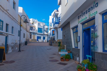 El Cotillo, Spain, Janury 25, 2021: Narrow street at El Cotillo village at Fuerteventura, Canary islands, Spain