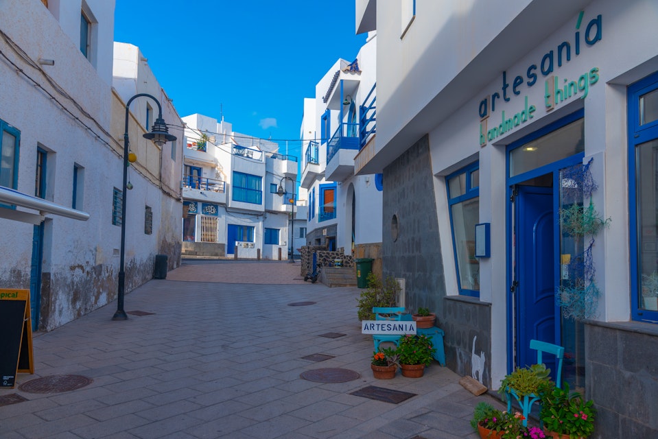 El Cotillo, Spain, Janury 25, 2021: Narrow street at El Cotillo village at Fuerteventura, Canary islands, Spain