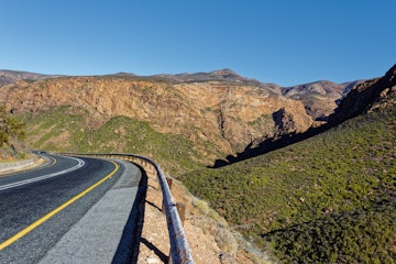 Scenic Route 62 highway at Huisrivier Pass with dramatic rock cliffs near Calitzdorp in Little Karoo in Western Cape, South Africa