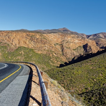 Scenic Route 62 highway at Huisrivier Pass with dramatic rock cliffs near Calitzdorp in Little Karoo in Western Cape, South Africa