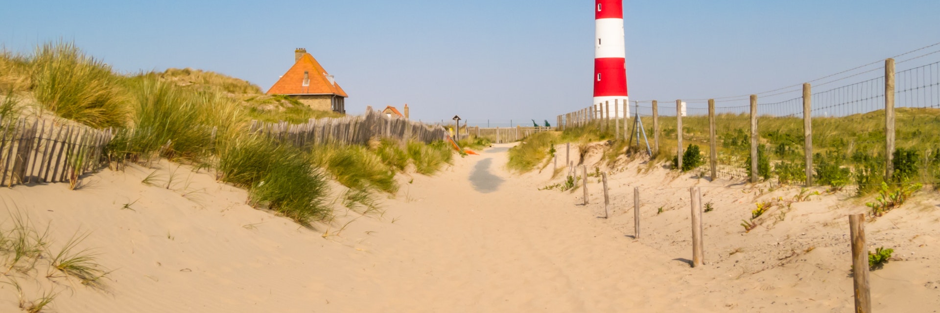 Lighthouse on the coast of the North Sea in a sunny day, Belgium