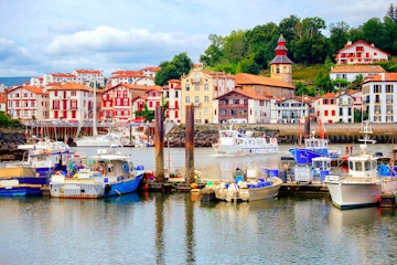 Traditional half-timbered basque houses in port of St Jean de Luz, on the atlantic coast of France