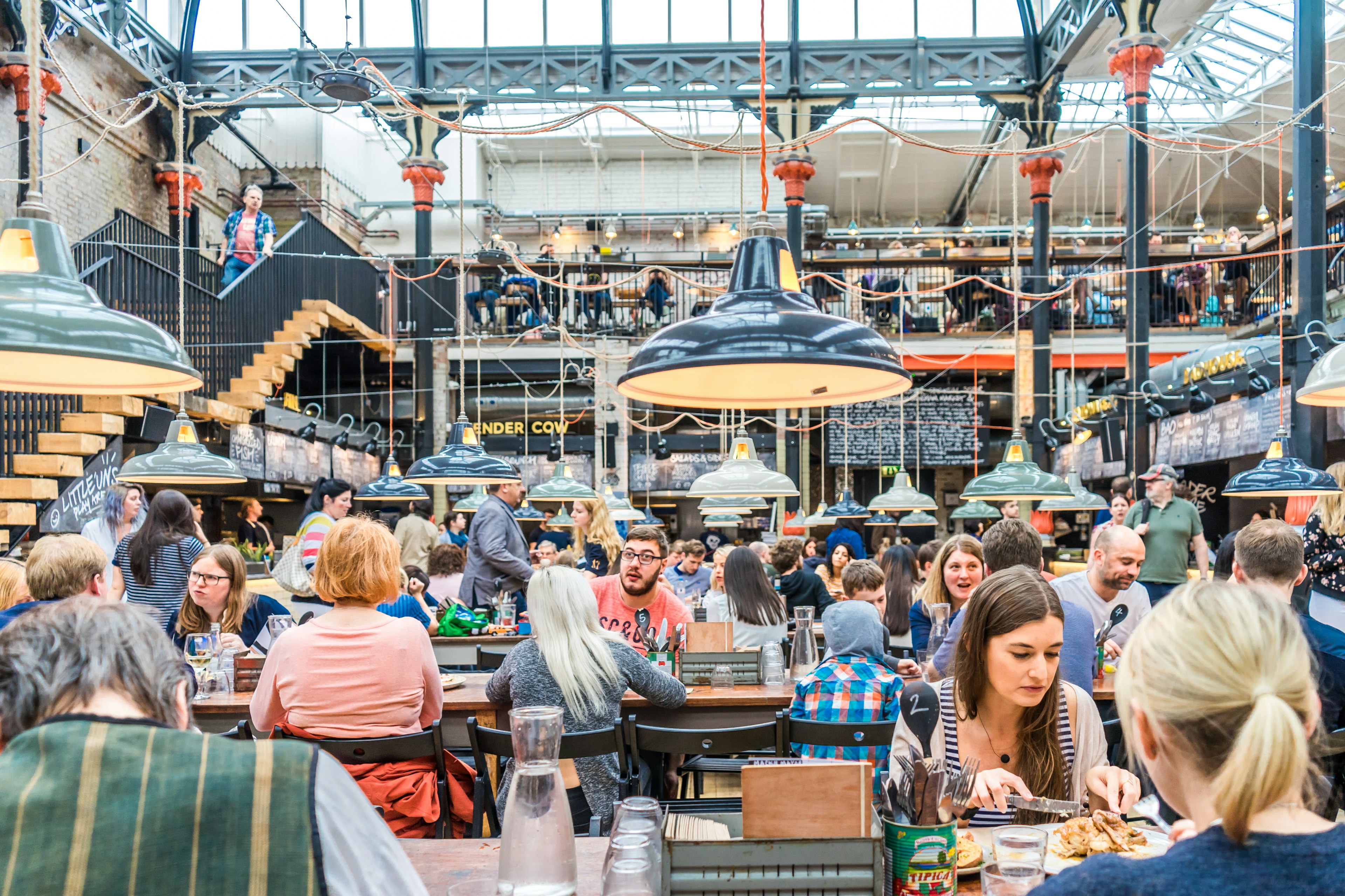 A crowd of people at Mackie Mayor, an 1858 market building that has been turned into a restaurant and food hall