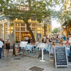 June 30, 2018: People dining at a terrace of a Greek restaurant in the Plaka neighbourhood of Athens.