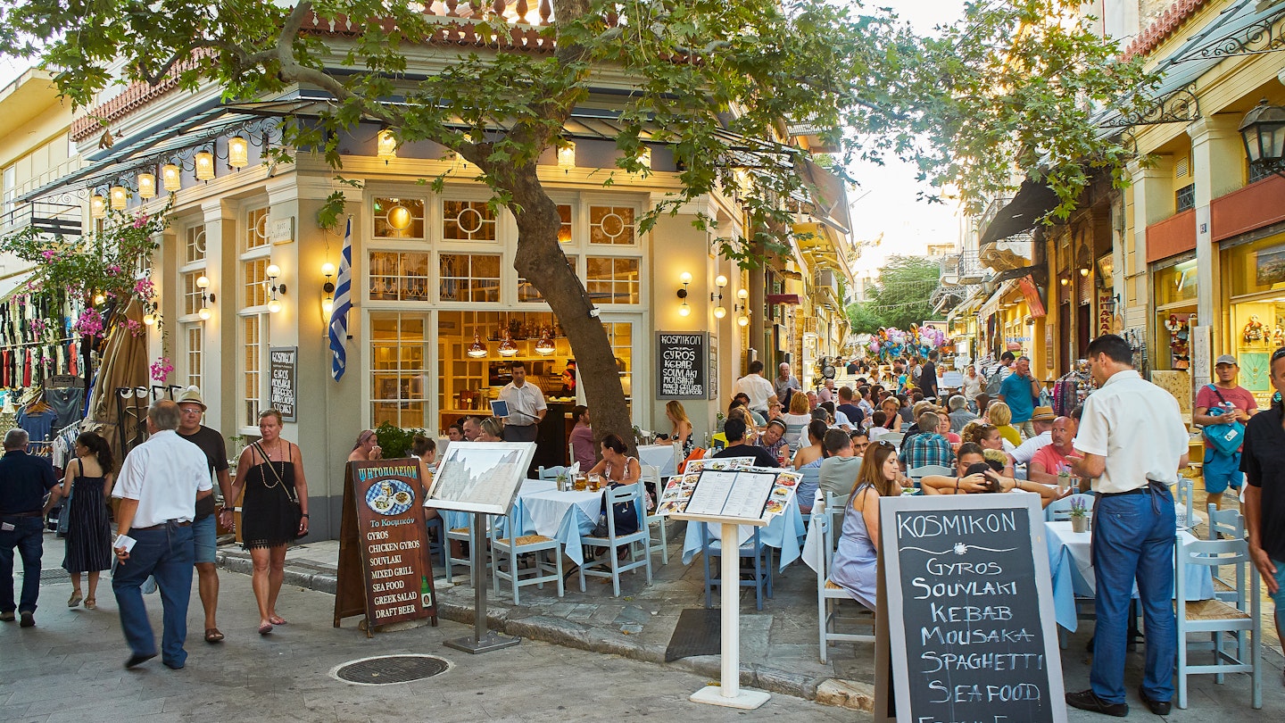June 30, 2018: People dining at a terrace of a Greek restaurant in the Plaka neighbourhood of Athens.