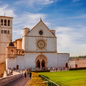 OCTOBER 23, 2019: Exterior of the Basilica of Saint Francis of Assisi in Umbria during sunset.