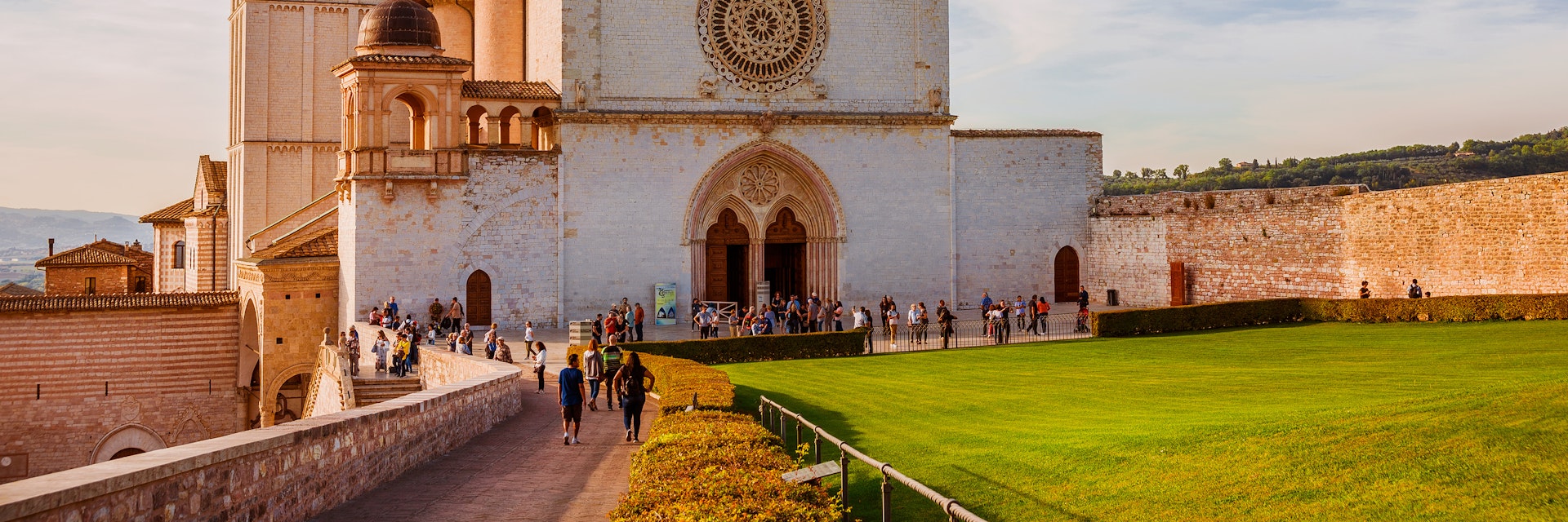 OCTOBER 23, 2019: Exterior of the Basilica of Saint Francis of Assisi in Umbria during sunset.