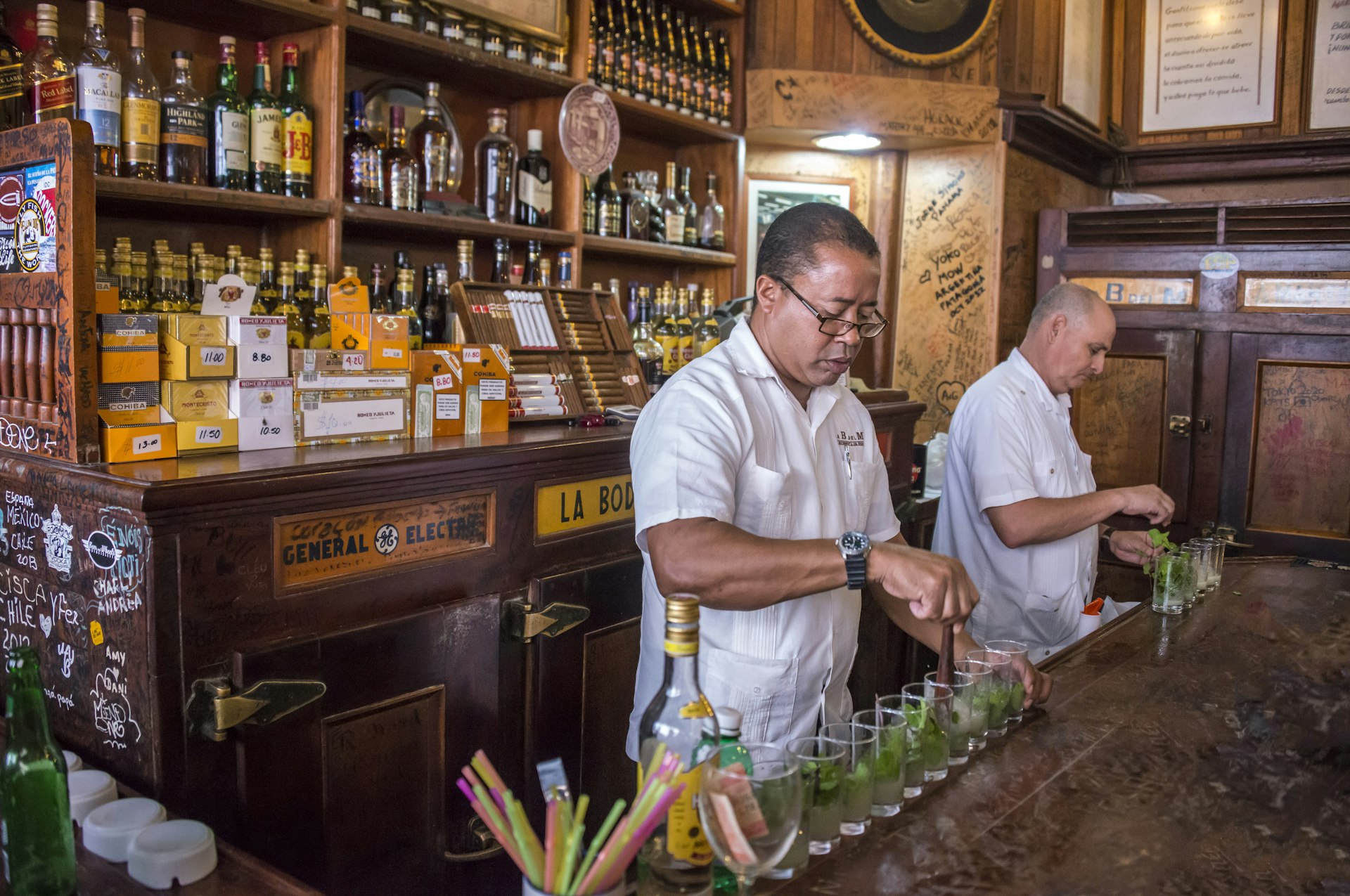 Two barmen preparing mojitos in Havana, Cuba