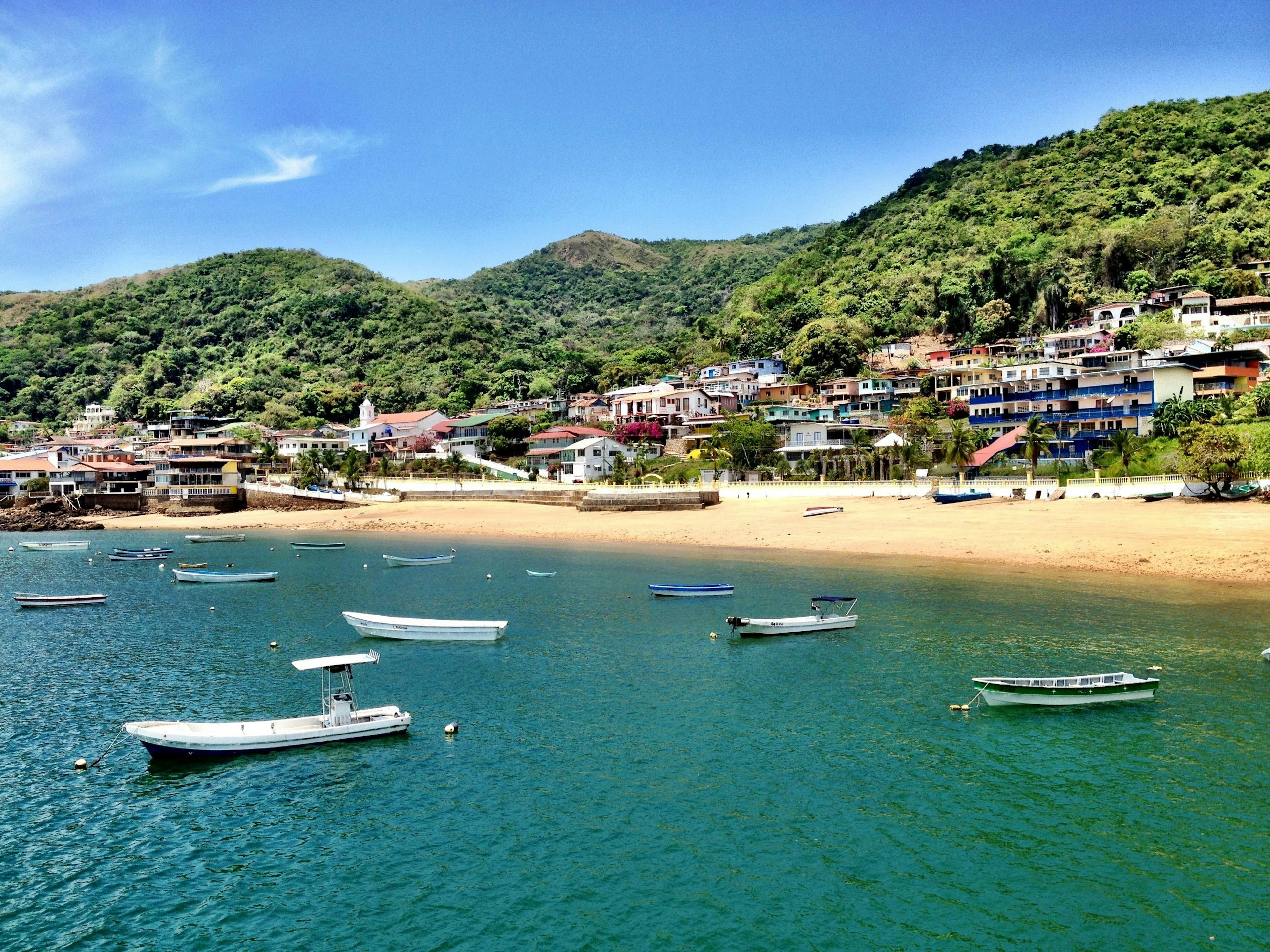 Boats anchored near the beach at Taboga Island in Panama