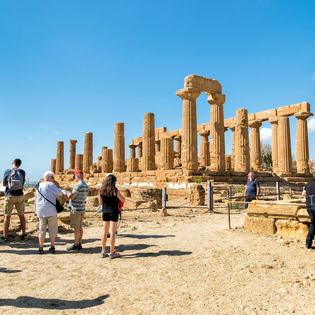 Agrigento, Sicily, Italy - October 9, 2017: Tourists visiting Park of the Valley of the Temples in Agrigento.