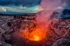 Volcano crater eruption with flowing lava and smoke.  The Masaya Volcano near Managua, Nicaragua main crater after sunset.; Shutterstock ID 1071081989; your: -; gl: -; netsuite: -; full: -