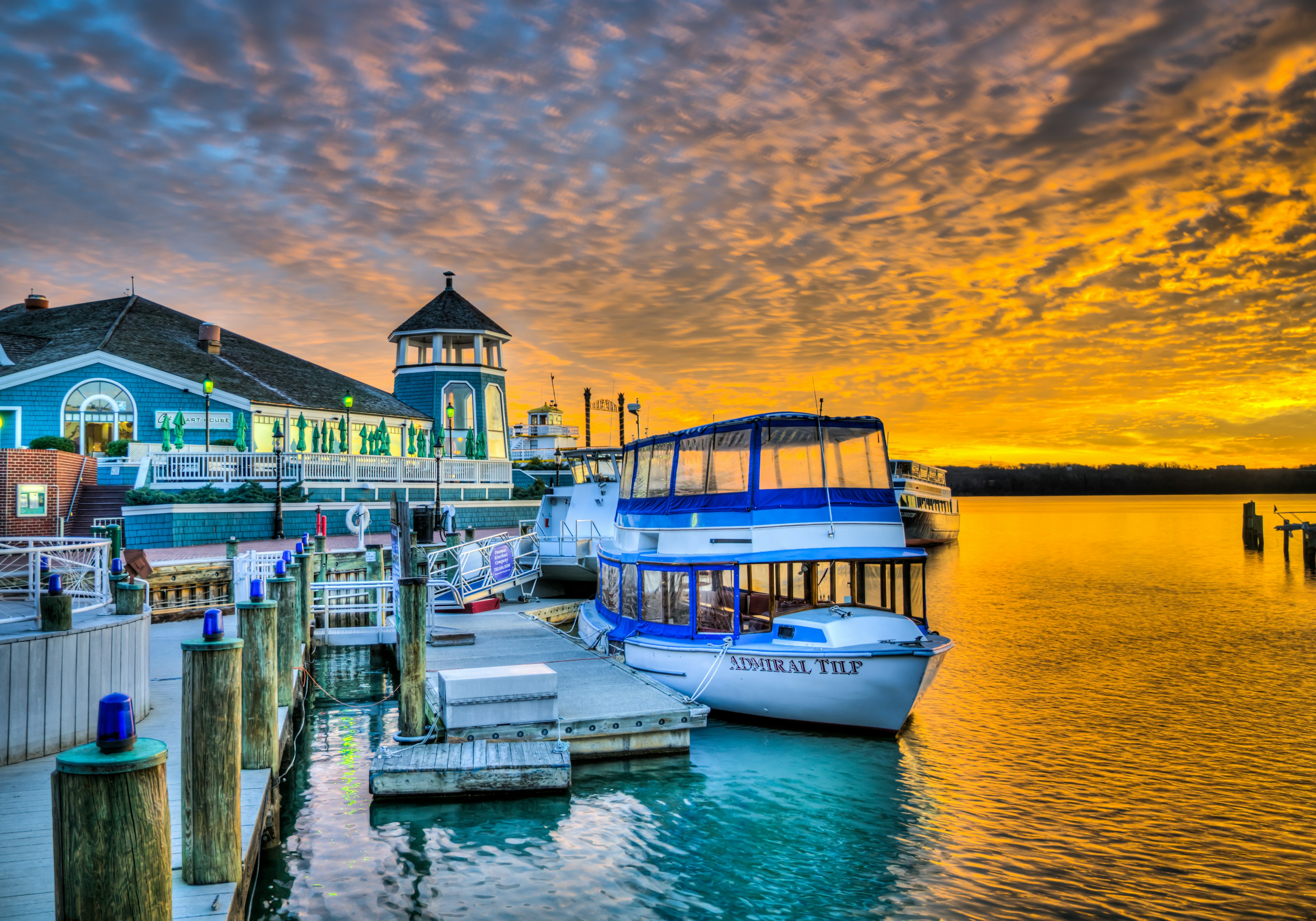 A boat along the dock at the Old Town waterfront at sunset, Alexandria, VA