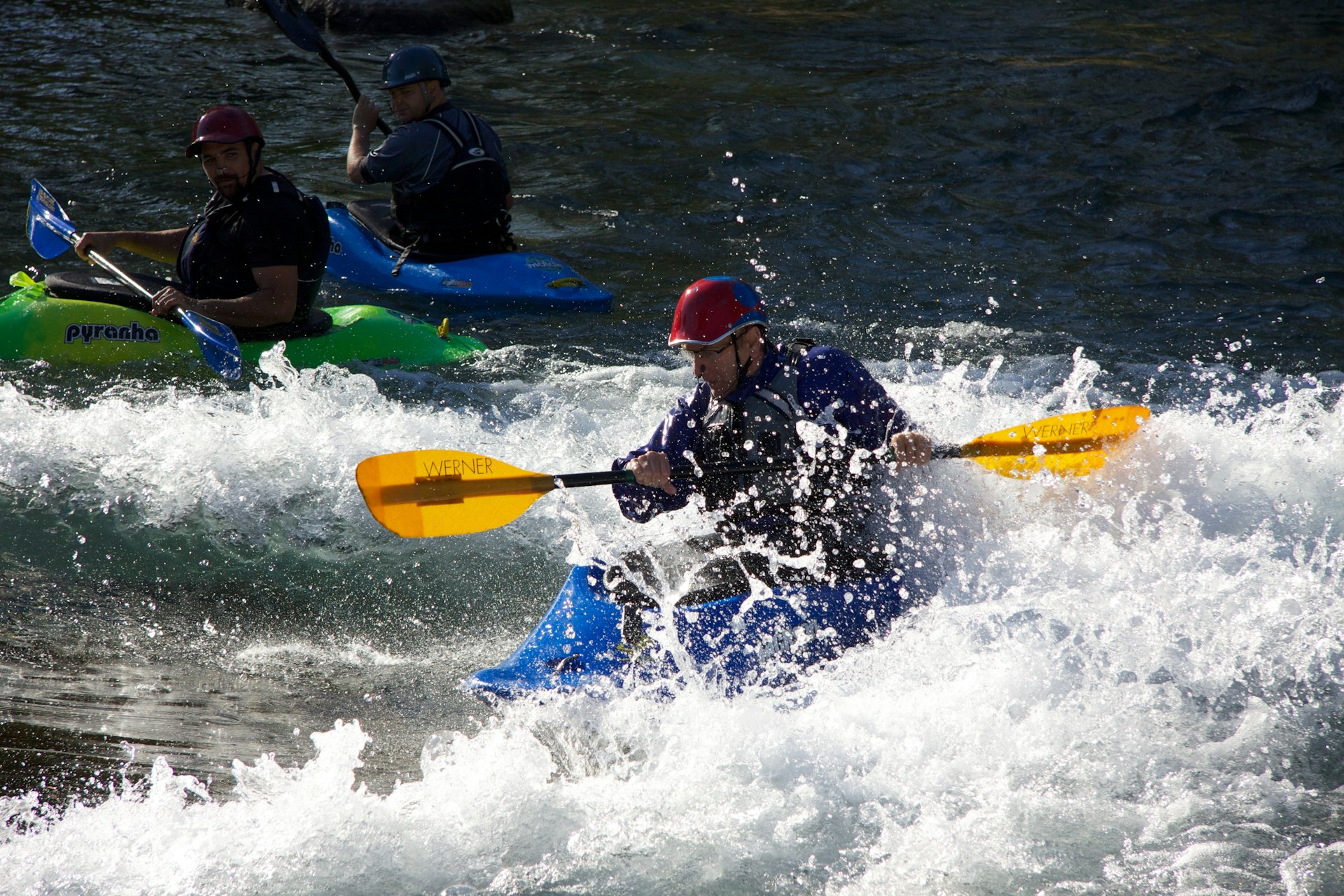 A kayaker paddles through rapids on the San Marcos River, San Marcos, Texas, USA