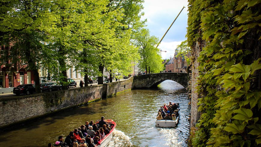 People on a canal boat tour in Bruges