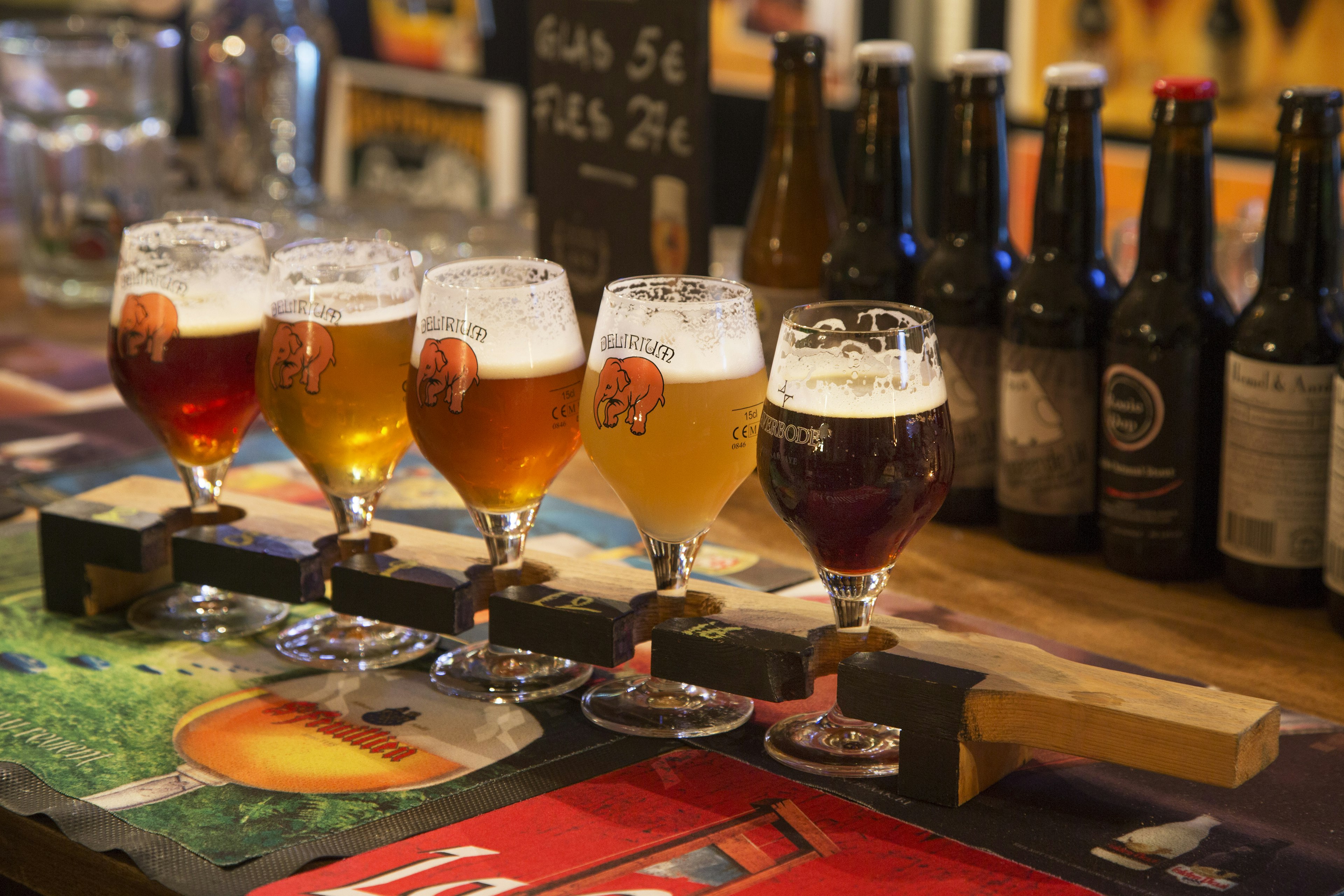 Beer sampler plank with Belgian beers for beer tasting in Flemish cafÅ½.