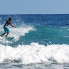 Professional surfer, surfing a wave. Water sport activity. Atlantic Ocean Dominican Republic. 29.12.2016.