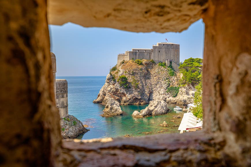 A large stone fortress on a cliff by the sea in Dubrovnik