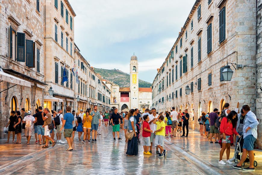 Tourists stroll along Stradun in the old town of Dubrovnik
