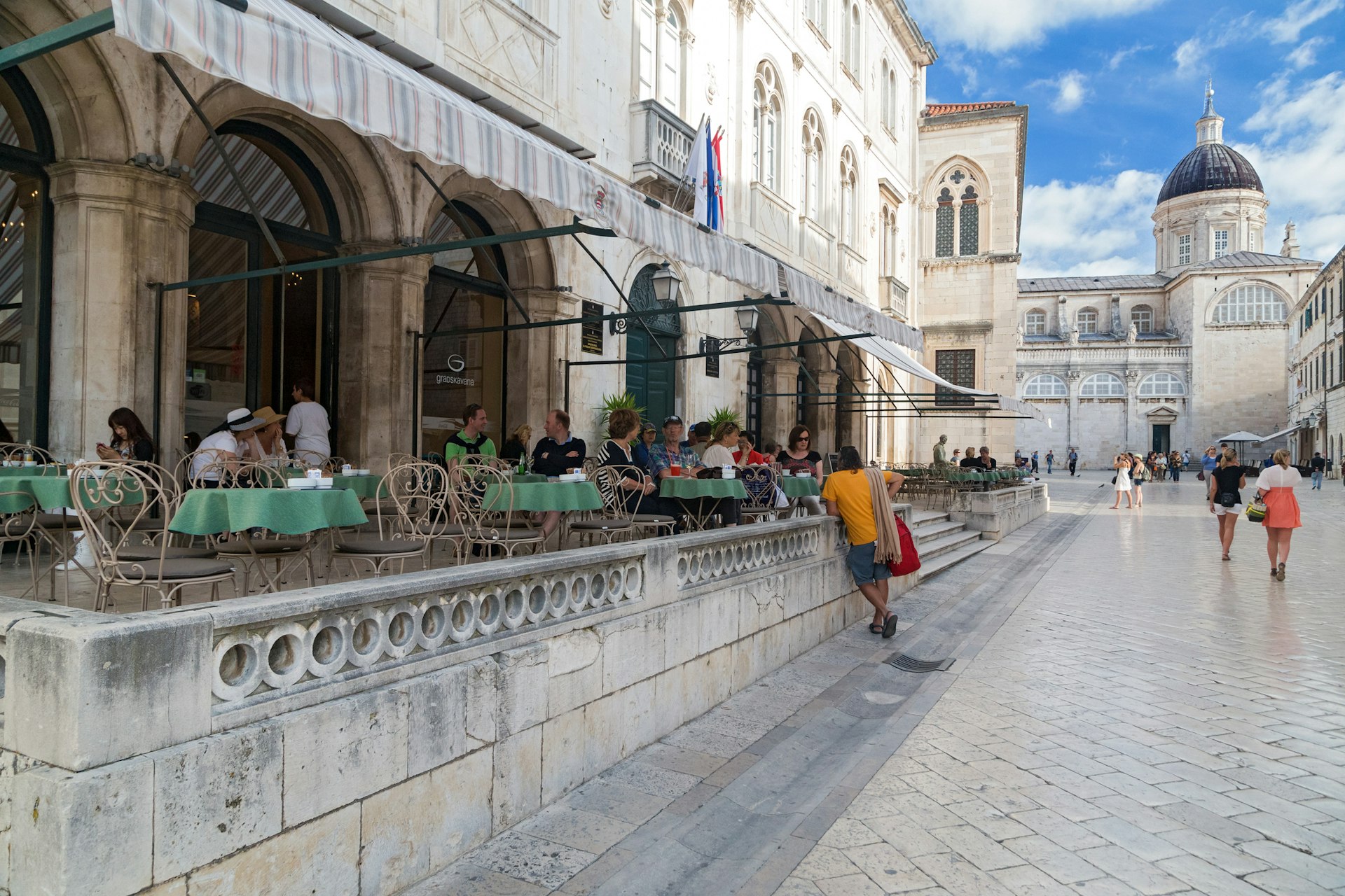 Guests sitting on the terrace of Gradska kavana cafe in Dubrovnik