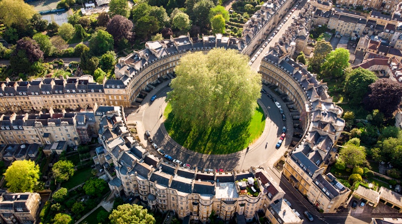 The Circus, one of the architectural centerpieces of the historic city of Bath is seen from the air – a circle of buildings sits around a large central tree © Matt Cardy / Getty Images
