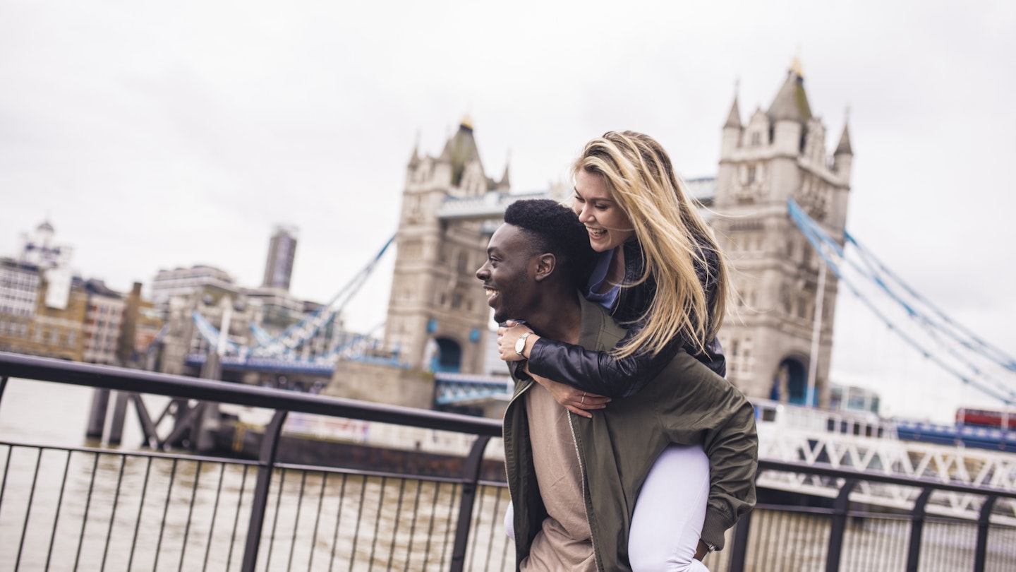 A young couple enjoying each others company outdoors in London