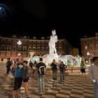 People at the fountain at Place Massena