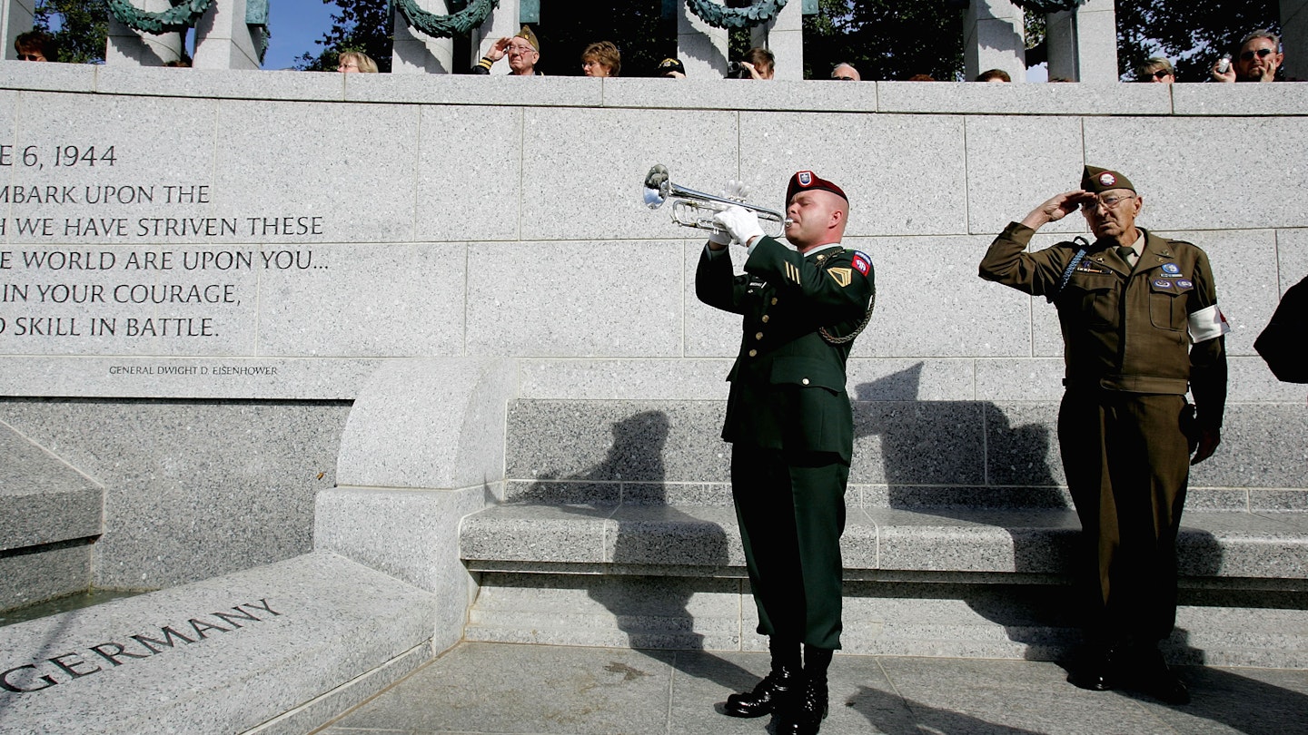 Nation's Capitol Observes Veterans Day - stock photo
WASHINGTON - NOVEMBER 11: U.S. Army staff sergeant Daniel H. Marshall from the 82nd Airborne plays taps as Korean War veteran Edward Bottge salutes during a Veterans Day ceremony at the World War II memorial November 11, 2004 in Washington, DC. The memorial opened to the public earlier this year.