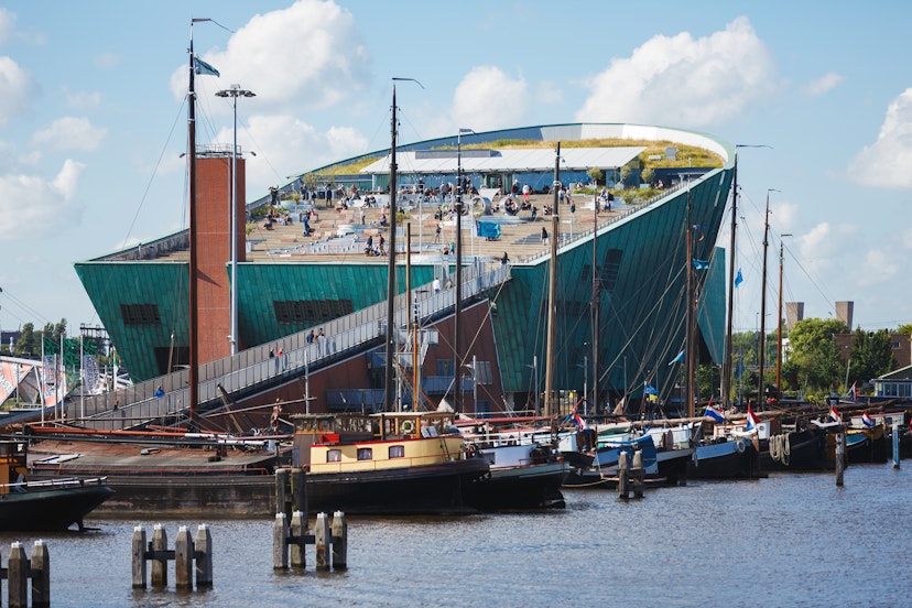 NEMO Science Museum, Amsterdam - stock photo
Amsterdam, Netherlands - July 2, 2016: Some people visit of NEMO Science museum, view from Oosterdok street, sunny day