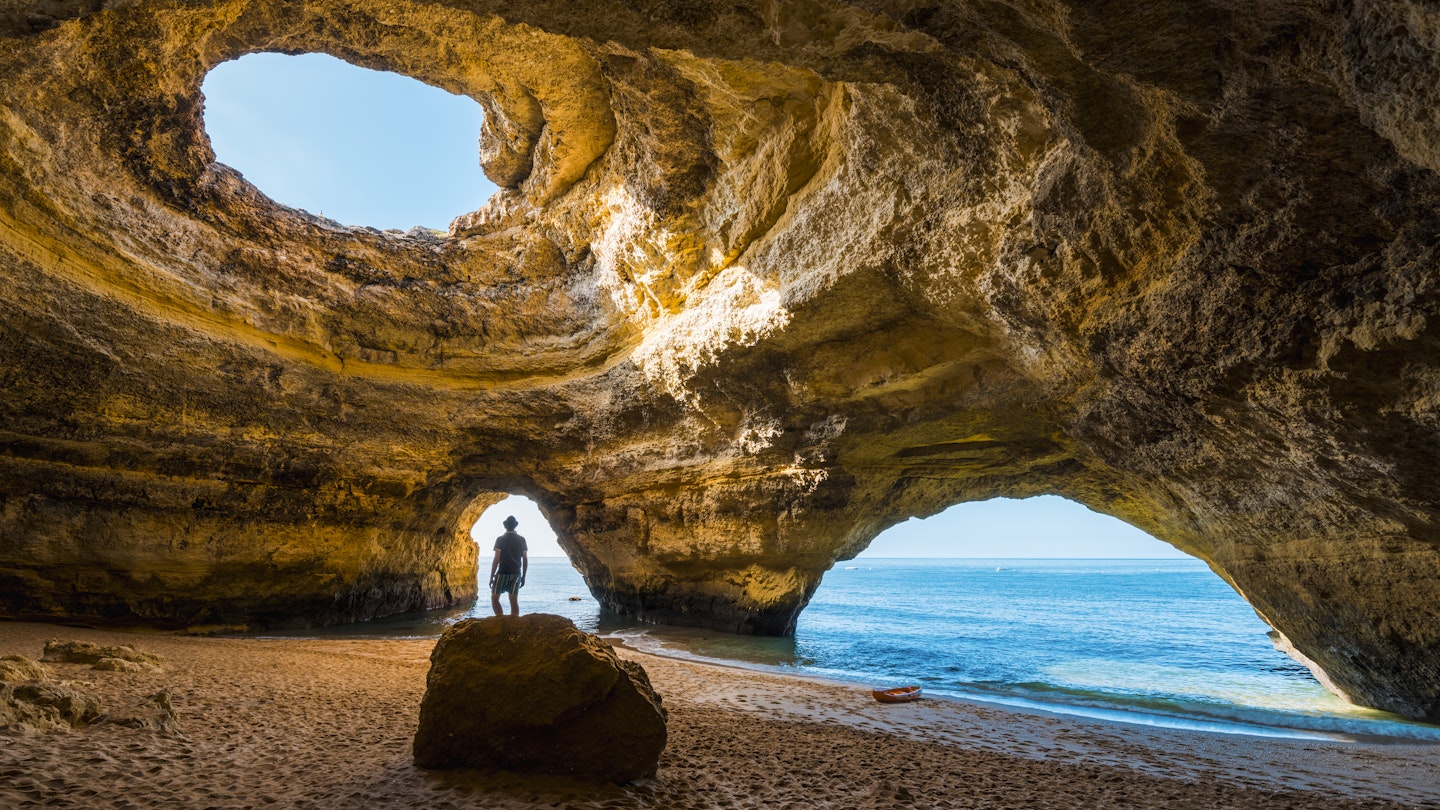 Solitary man inside the Benagil caves, Portugal