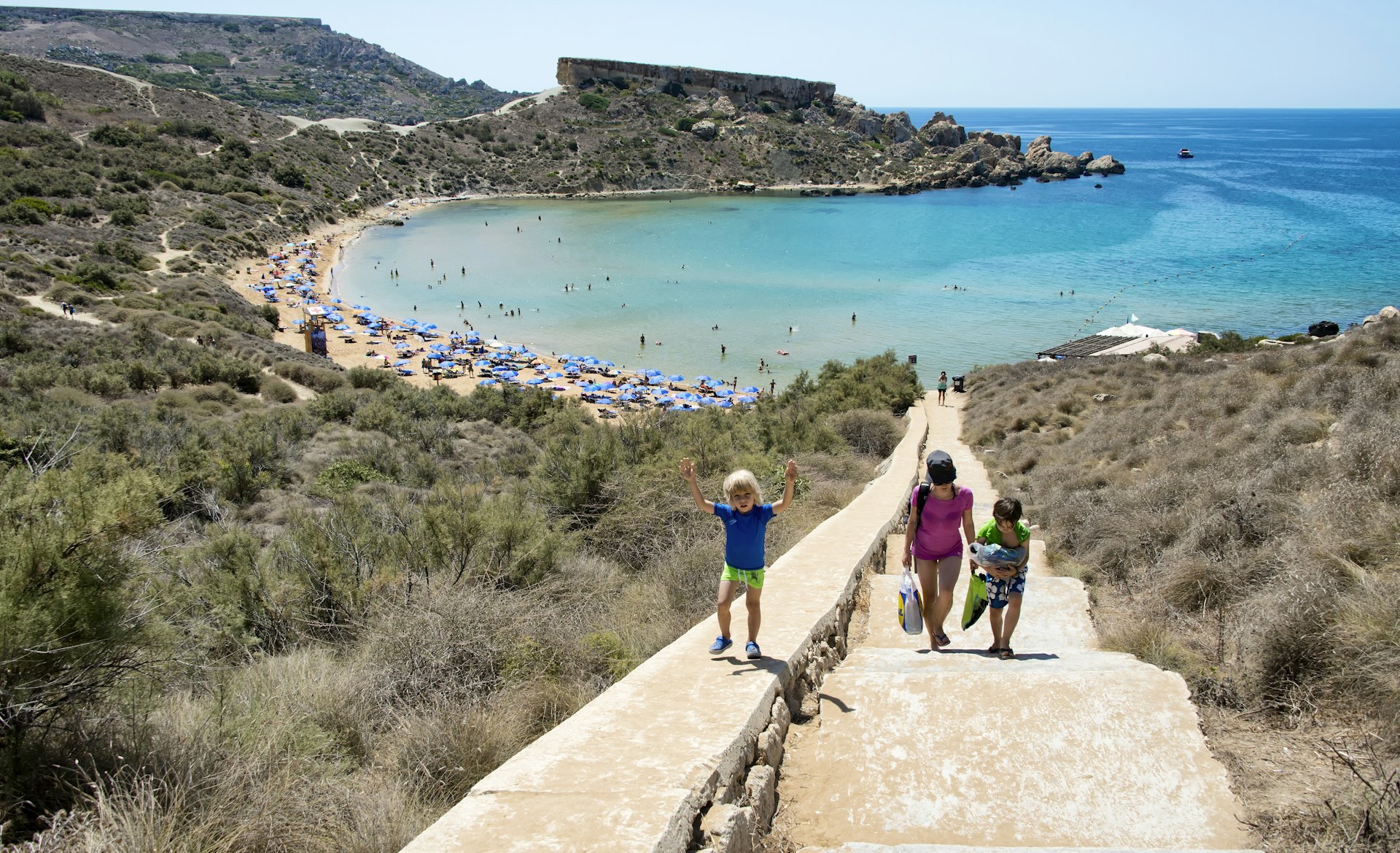 Family walk to Ghajn Tuffieha beach, Malta