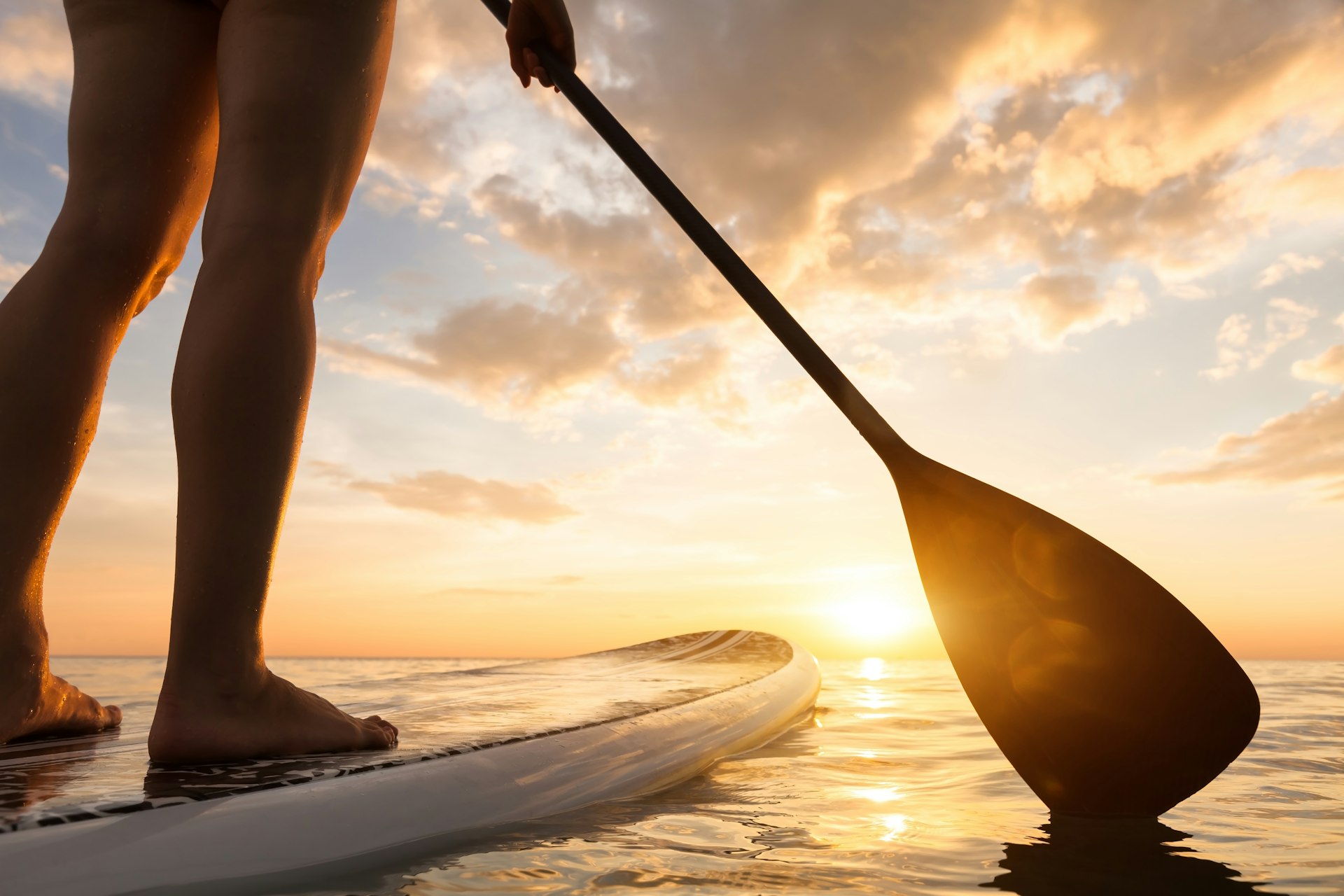 Stand up paddle boarding on quiet sea in Panama