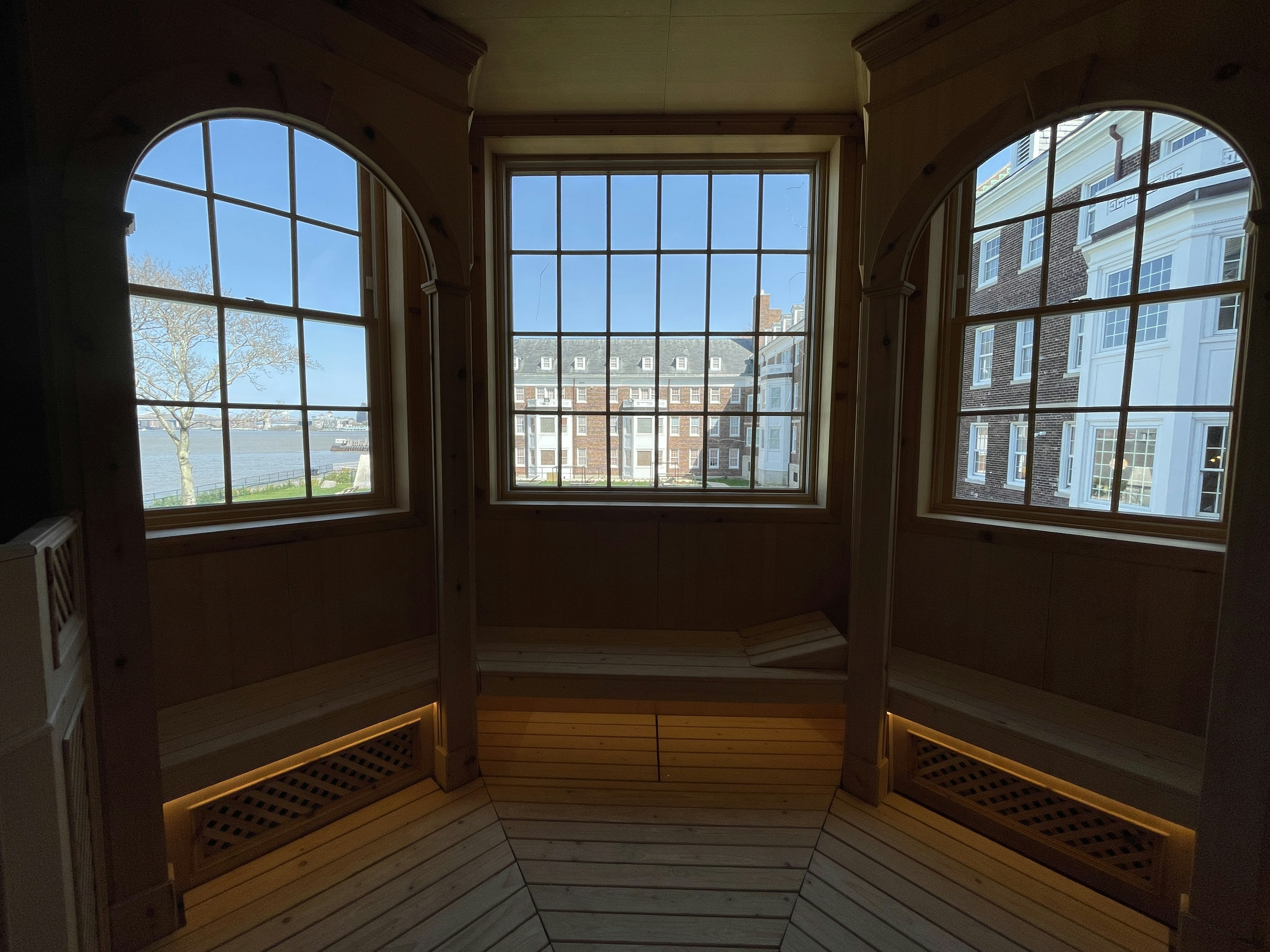 A sauna with a view on the QC NY pool and courtyard