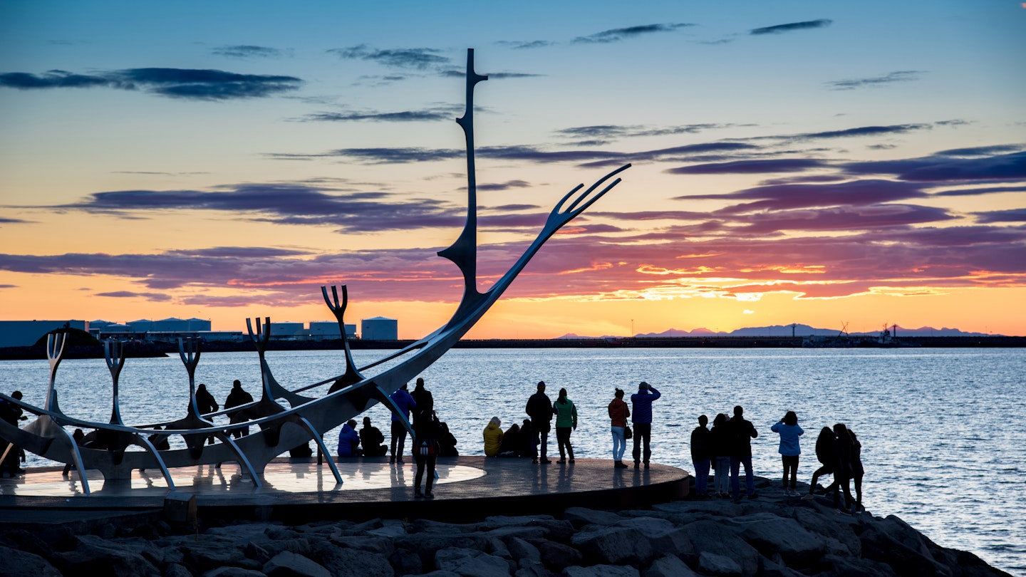 People gathered around the Sun Voyager sculpture in Reykjavik
