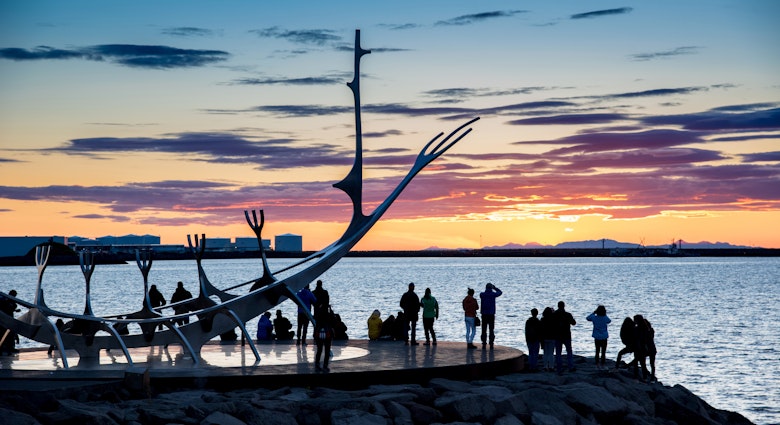 People gathered around the Sun Voyager sculpture in Reykjavik