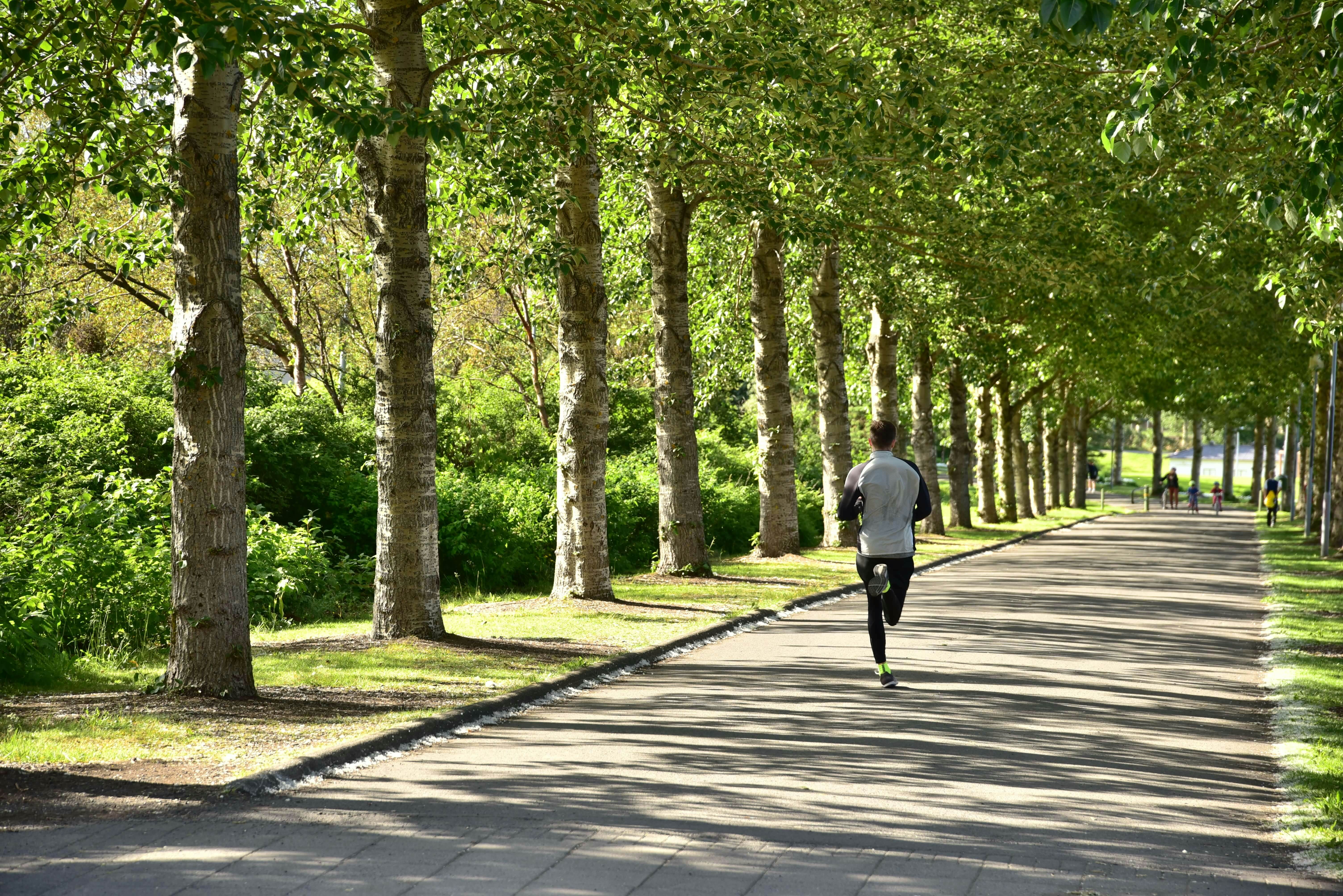 one man running in a park in Reykjavik, Iceland