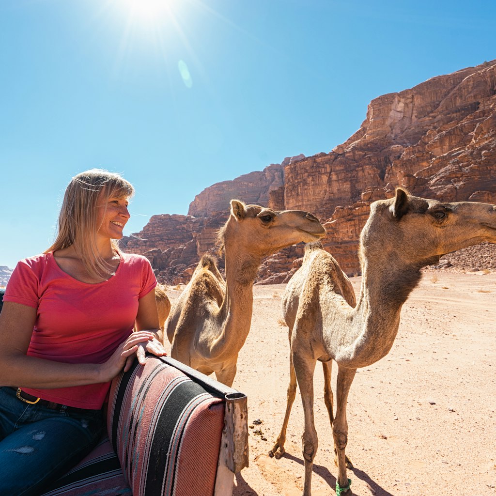 Tourist and camel in desert Wadi Rum, Jordan.; Shutterstock ID 1677705418; your: Brian Healy; gl: 65050; netsuite: Lonely Planet Online Editorial; full: Visa requirements for Jordan