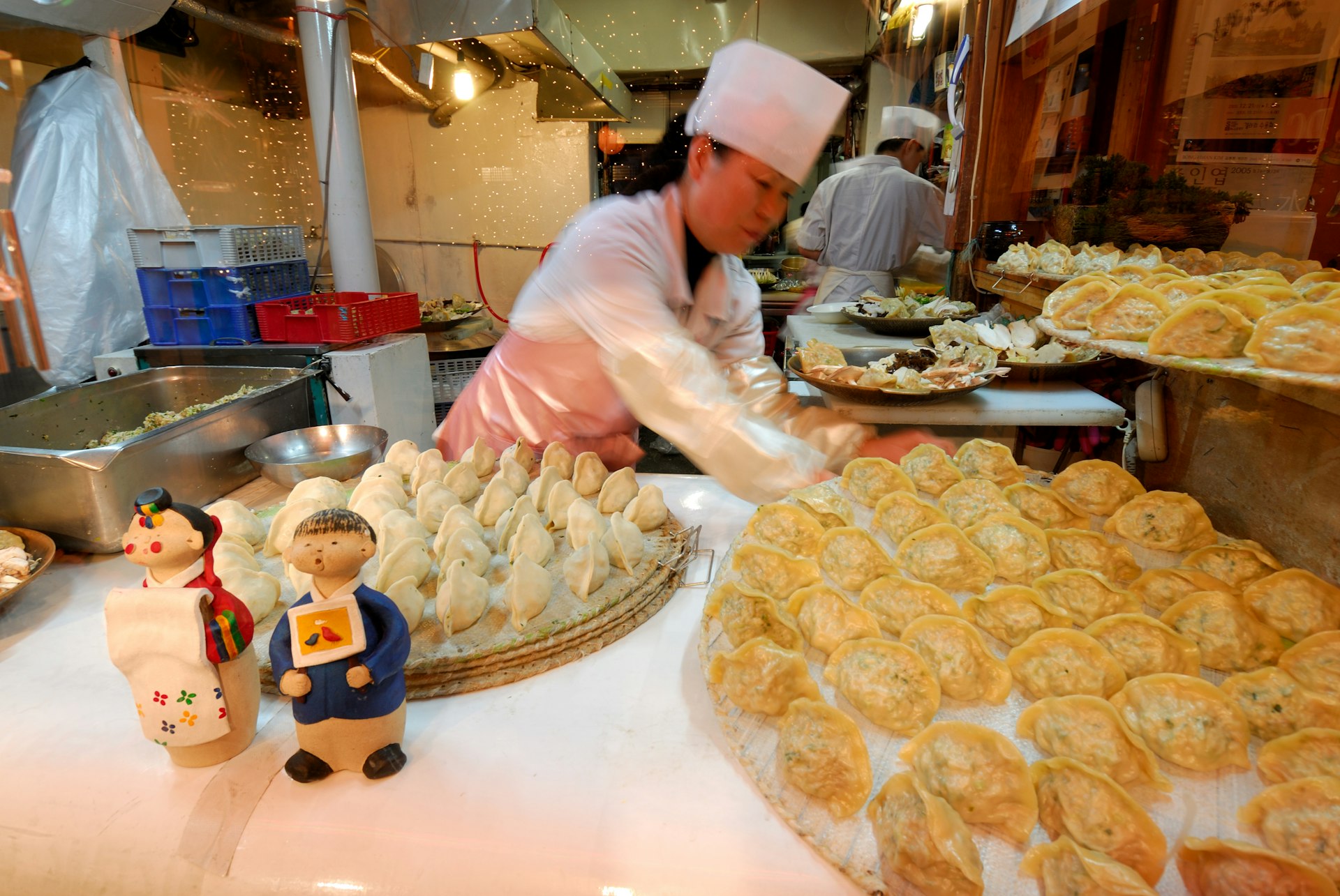 Woman making mandu (dumplings) in Seoul, South Korea